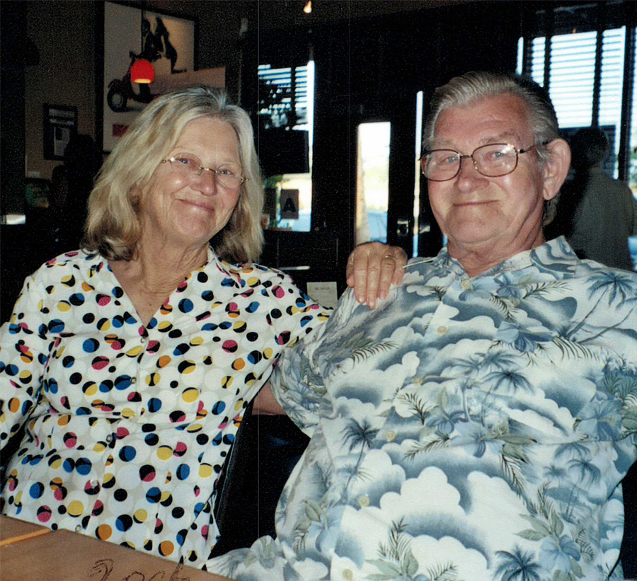 Smiling senior couple seated indoors Smiling senior couple seated indoors